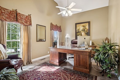 Sun-drenched main level office with vaulted ceiling
