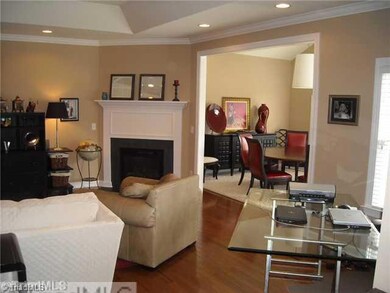 Living Room. The room is large enough to have space for a home office in one corner or add a dining table there if you prefer to use the sunroom for other purposes. Gas log fireplace with detailed woodworking.Open to kitchen and sunroom/dining room...