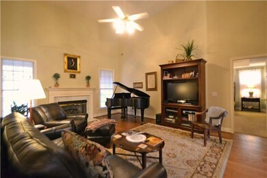 Large great room w/high ceilings . . . filled with natural light