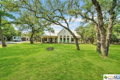 Front of home on tree covered 5 acre lot