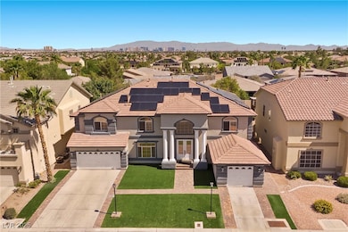 View of front facade with driveway, french doors,