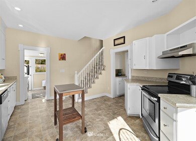 Huge country-style kitchen provides ample space for being the hub of the home.  Stainless steel appliances and tons of cabinet space make this a dream kitchen!
