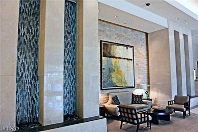 Building lobby with a surveillance system, tile wa