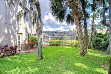 This spacious backyard, complete with a screened enclosure, offers the perfect blend of tranquility and functionality.