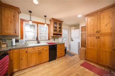 Beautifully renovated kitchen with door to back de