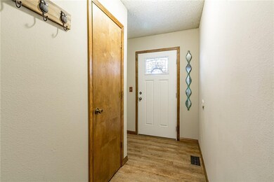 The Front Foyer offers a cubby for a cabinet or Hall tree, and a coat closet. Nice separation from the living room.