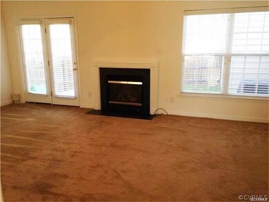 Spacious Living Room with French Doors to Deck and