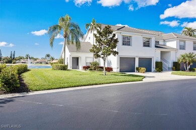 View of front of home with a garage and a front la