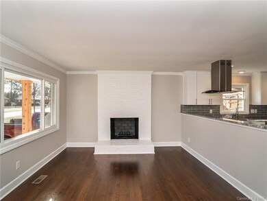 Open design with wood burning fireplace.