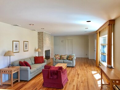 Bright living room, gleaming hardwood