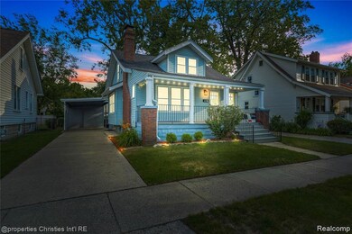 Bungalow-style home with a porch, a yard, driveway, and a chimney