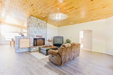 Huge rock fireplace in living room