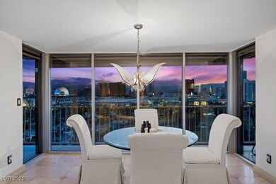 Dining room with a wall of windows, tile patterned