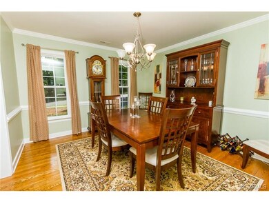 Formal dining room with hardwood floors