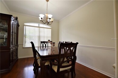 Formal dining, open to kitchen, with hardwood floo