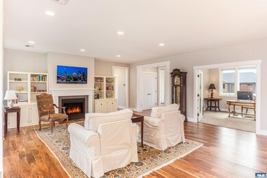 The main living area is warm and lovely with 9' ceilings, hardwod floors, lovely propane fireplace