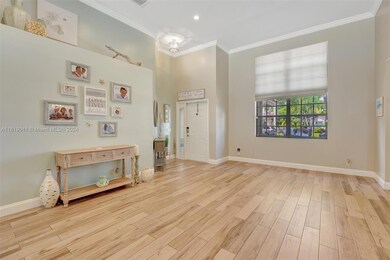 Spacious living area with beautiful neutral tile flooring throughout home.