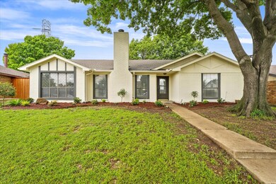 Ranch-style house with a front lawn
