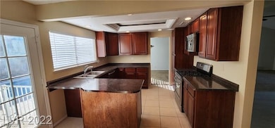 Kitchen featuring appliances with stainless steel