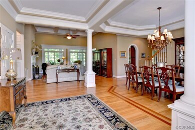 As you enter the foyer, you are greeted by an open living and dining area with the office to the left of the foyer.