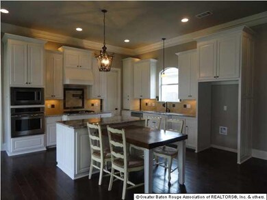 The kitchen has an extended solid wood table that 