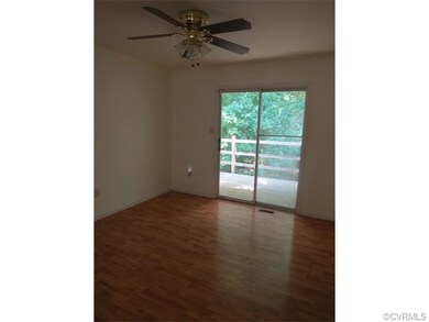 Dining area with ceiling fan -- doors out to the d