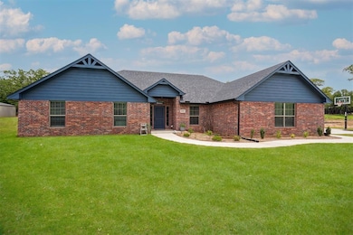 View of front of property with a shingled roof, br