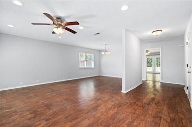 Spare room with dark wood-style floors, french doo