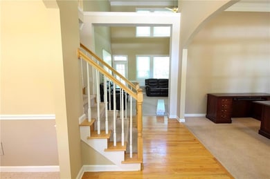Custom front door, 2 story foyer and hardwood entr