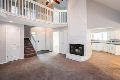 Unfurnished living room featuring a towering ceili