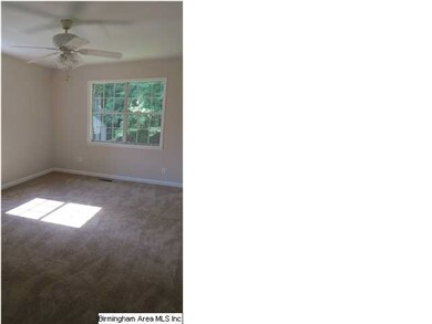 Master Bedroom with exterior door leading to backy