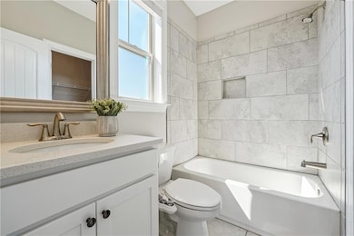 Bathroom with vanity,  shower combination, and tile patterned flooring