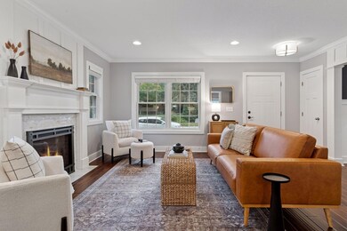 Bright and inviting living room, thoughtfully designed front entry, newer windows throughout the home.