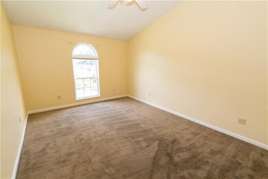 The large master bedroom has vaulted ceilings, cei