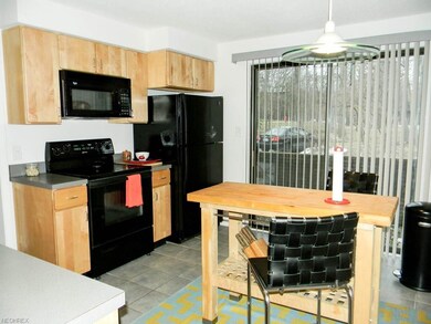 Eat-in kitchen with sliding doors to the front pat