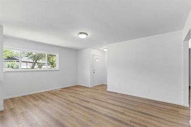 Spare room with light wood-style flooring and base