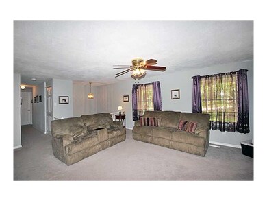 Living Room. The home has neutral decor with updat