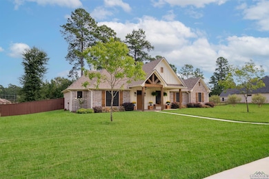 View of front of property with a porch, roof with shingles, and board and batten siding