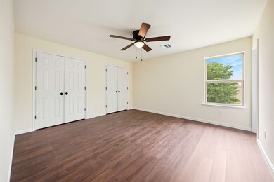 Natural light streams in this
bedroom, illuminati