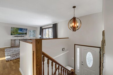 View of the foyer. Beautiful new light fixture!