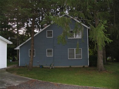 West view of the house from driveway.