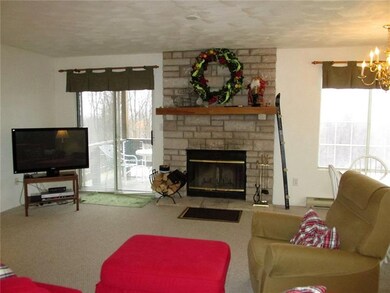 This stone faced fireplace is wood burning. The gl