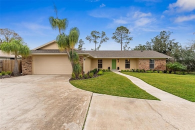 Front view showing 2 car garage very private property