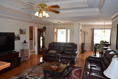 Walk in to an open area with beautiful trey ceilings