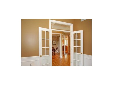 Secluded study, to the right of the entry, is a pe