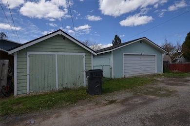 Alley view of garage and shed
