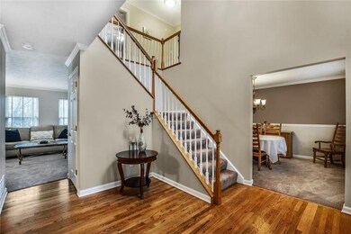Welcoming entry features hardwood flooring.