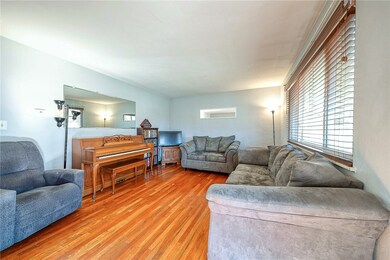 Hardwood floors, neutral paint, large front window
