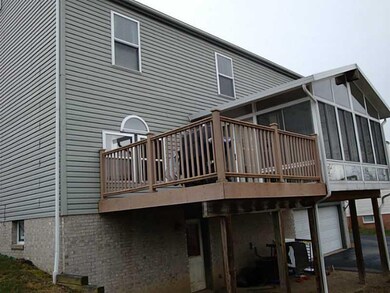 Exterior Back. Rear of home shows off the sunroom 