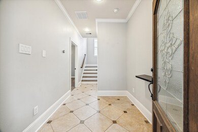 Inviting foyer with tile flooring
